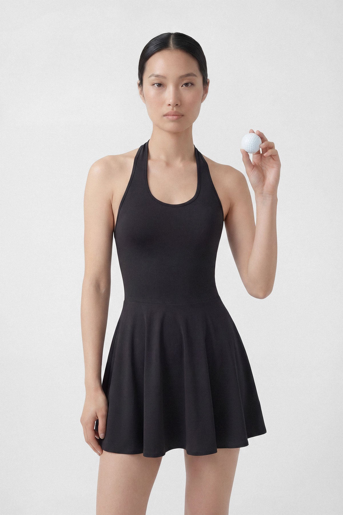 Black golf dress with built-in shorts and halter neck