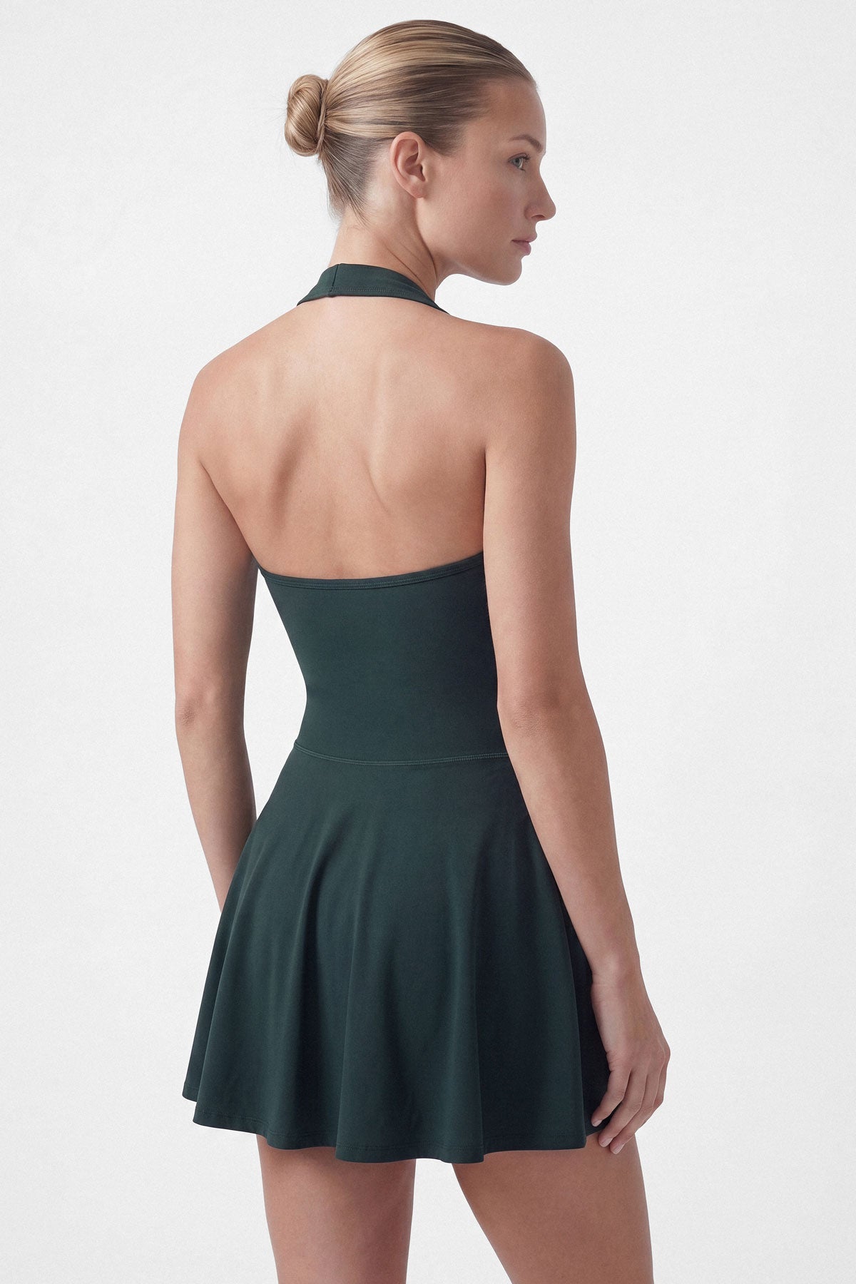 Dark green golf dress with built-in shorts and halter neck