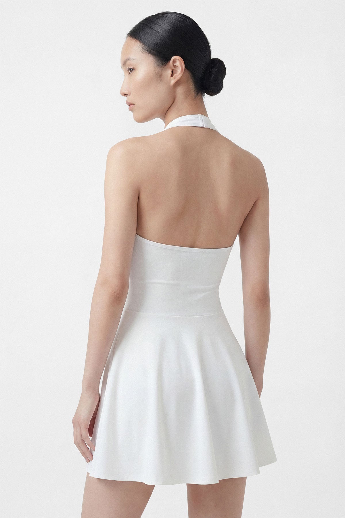 White golf dress with built-in shorts and halter neck