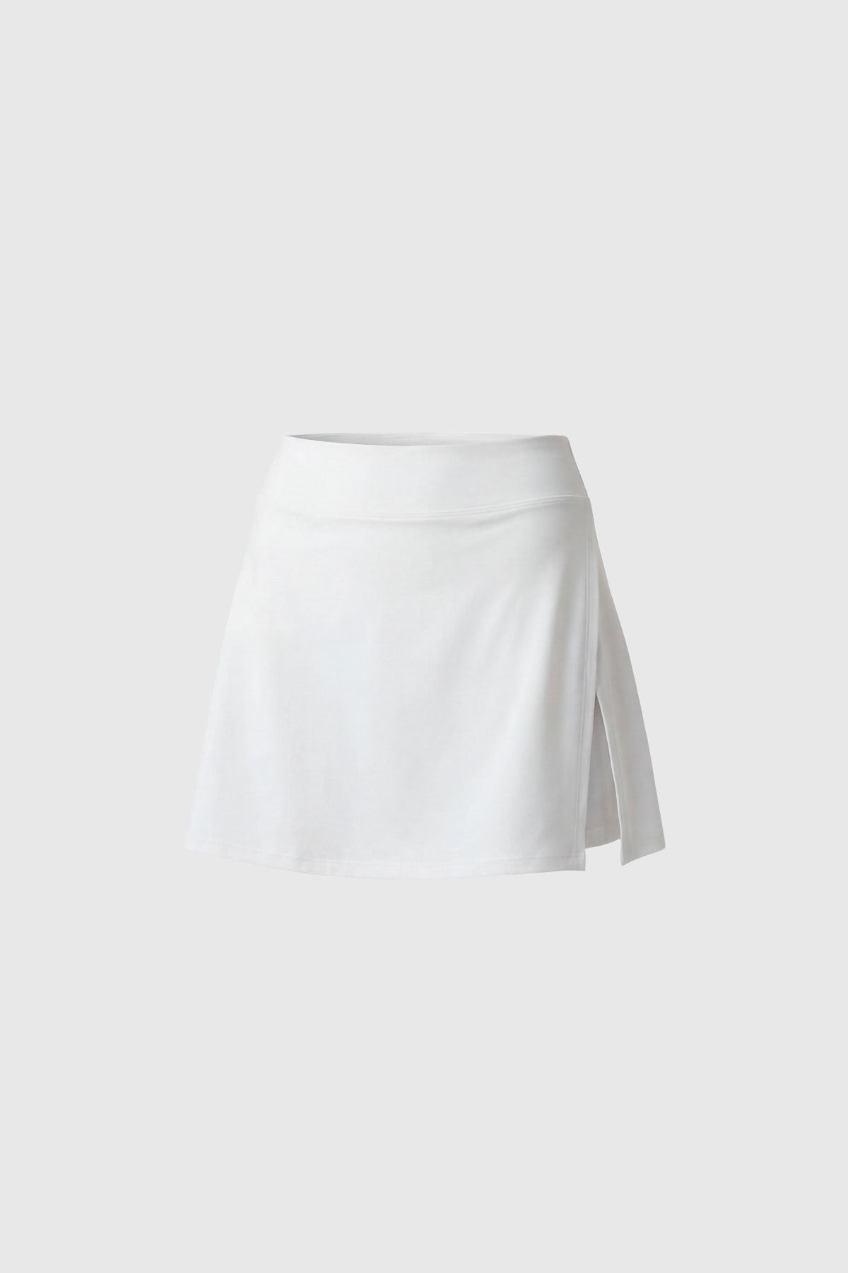White golf skort with built in shorts, side slit and pocket