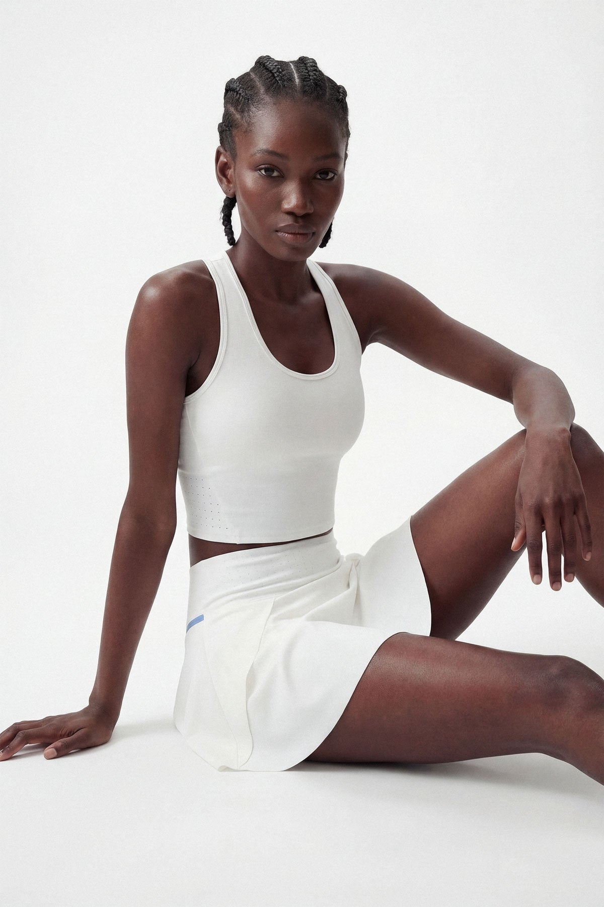A white tennis sports bra with removable bra cups