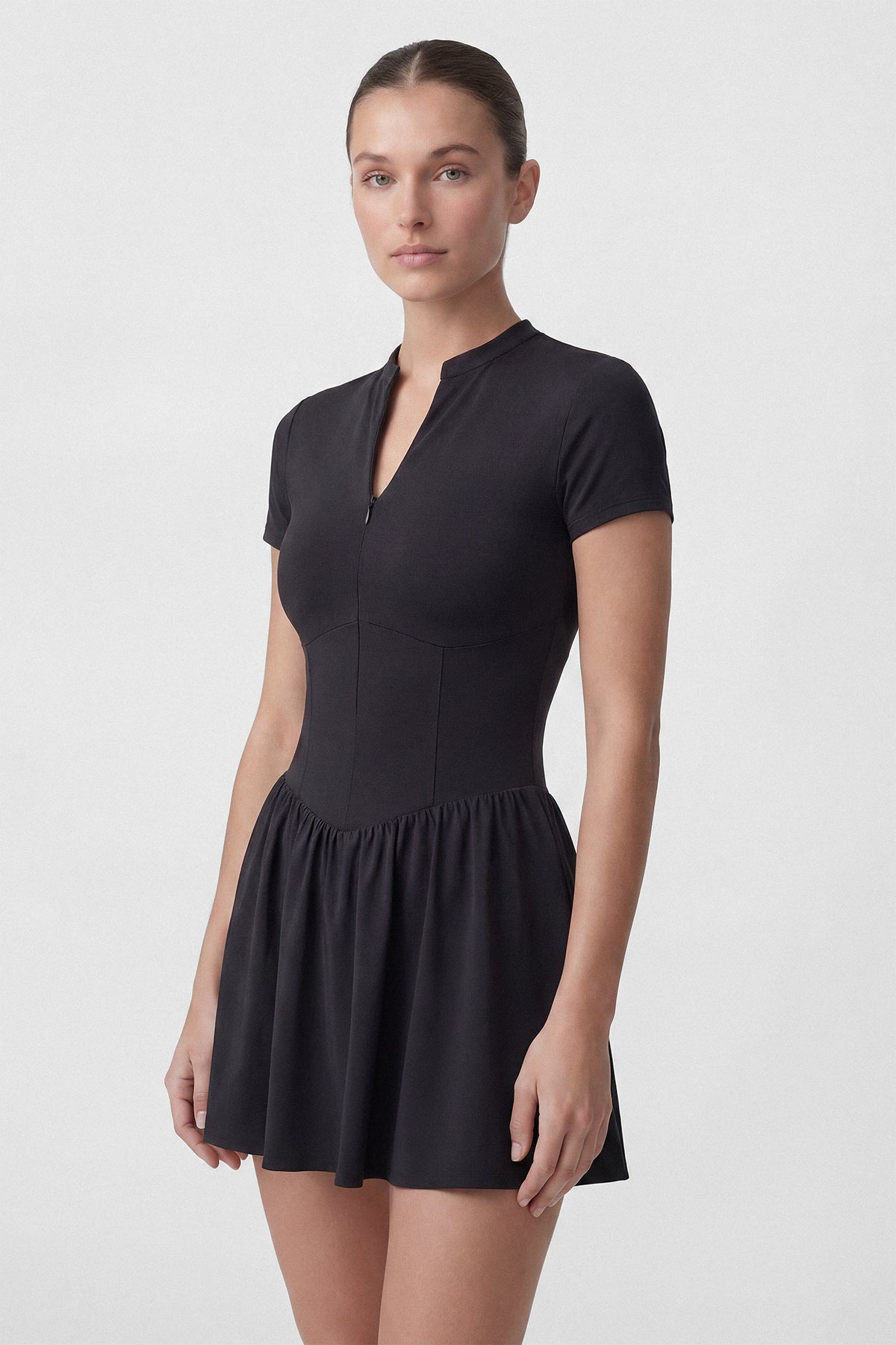Black Common Player golf dress with short sleeves and built in shorts