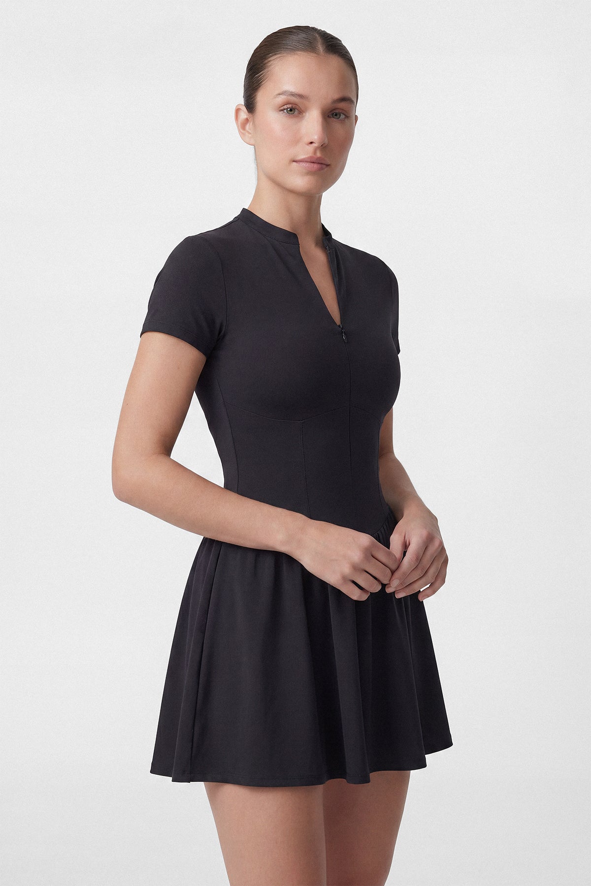 Black Common Player golf dress with short sleeves and built in shorts