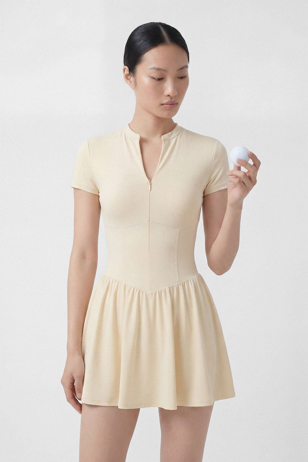 Butter yellow golf dress with short sleeves, built-in shorts and pocket