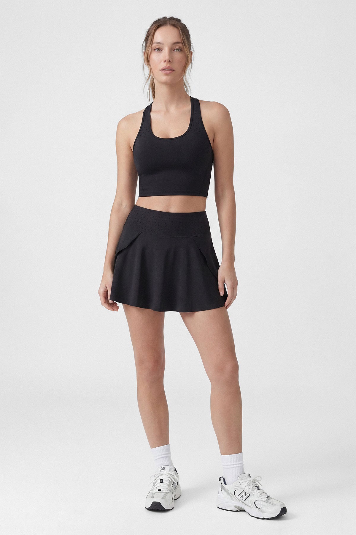 A black tennis skirt with built-in shorts and pocket