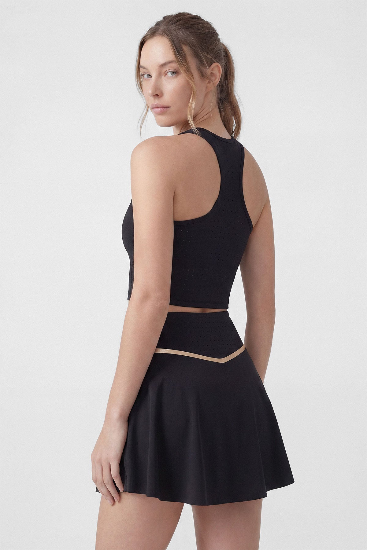 A black tennis skirt with built-in shorts and pocket