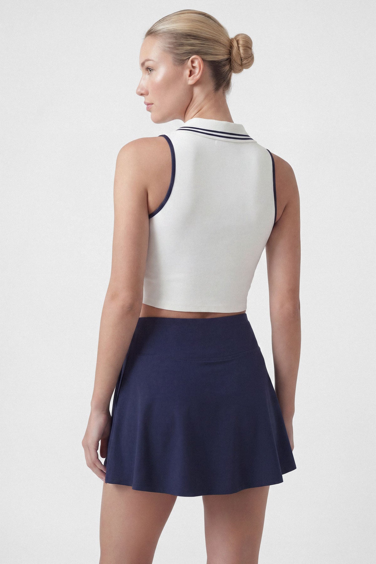 Flared tennis skirt in navy blue with built-in shorts and pocket