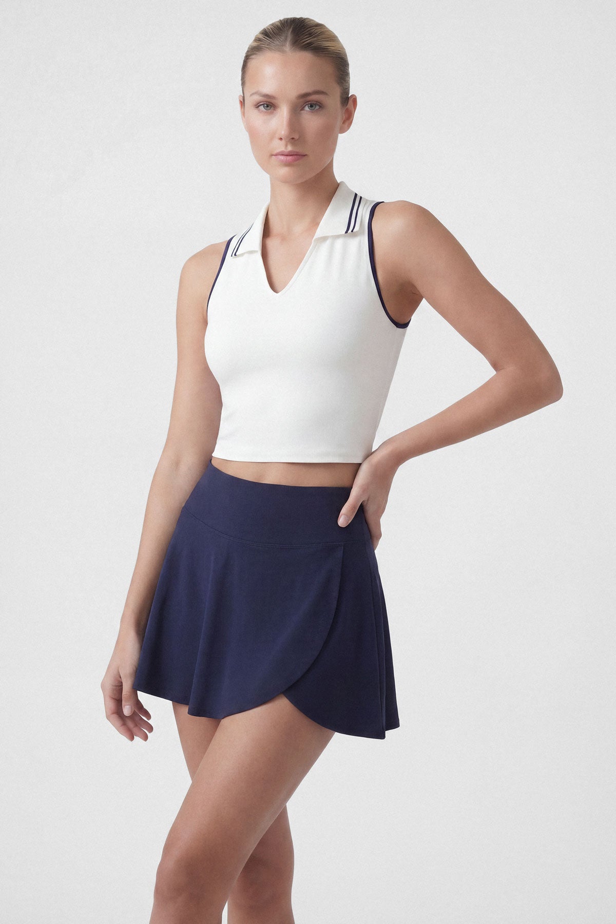 Flared tennis skirt in navy blue with built-in shorts and pocket