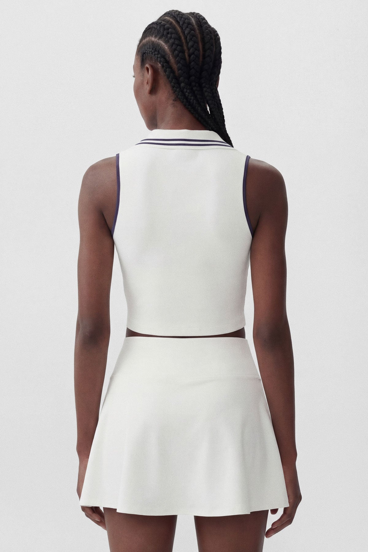 White flared tennis skirt with built-in shorts and a ball pocket