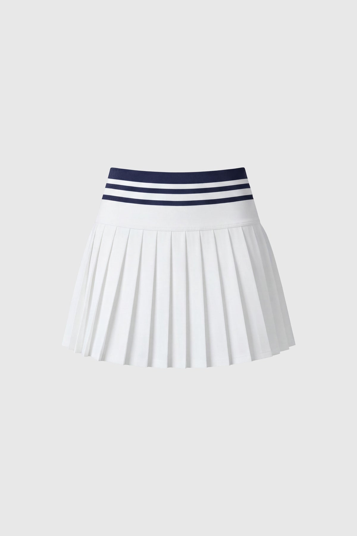 High-wasted white tennis skirt with a wide striped waistband and built-in shorts