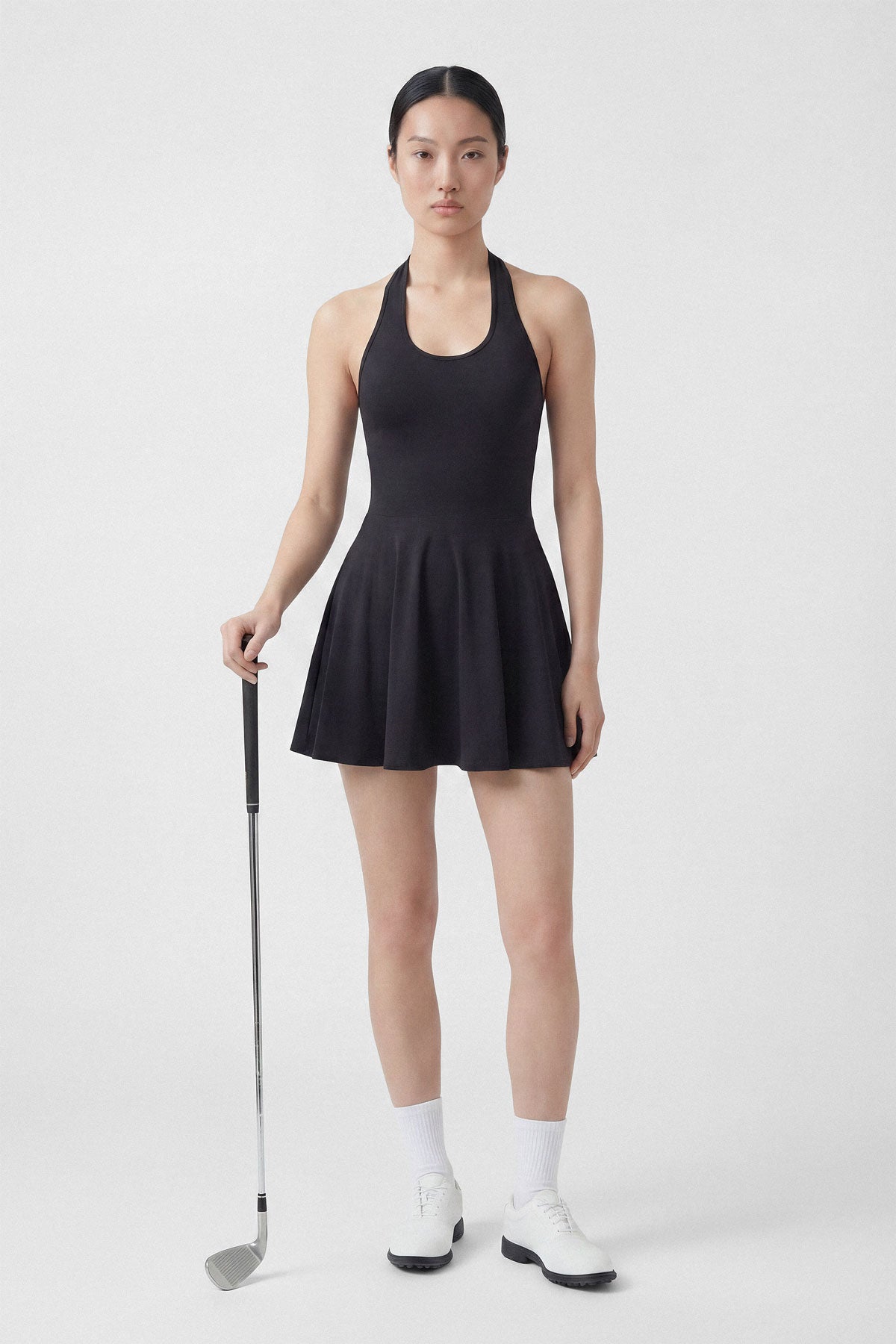 Black golf dress with built-in shorts and halter neck
