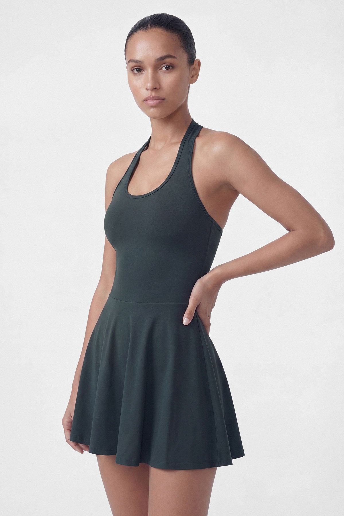 Dark green golf dress with built-in shorts and halter neck