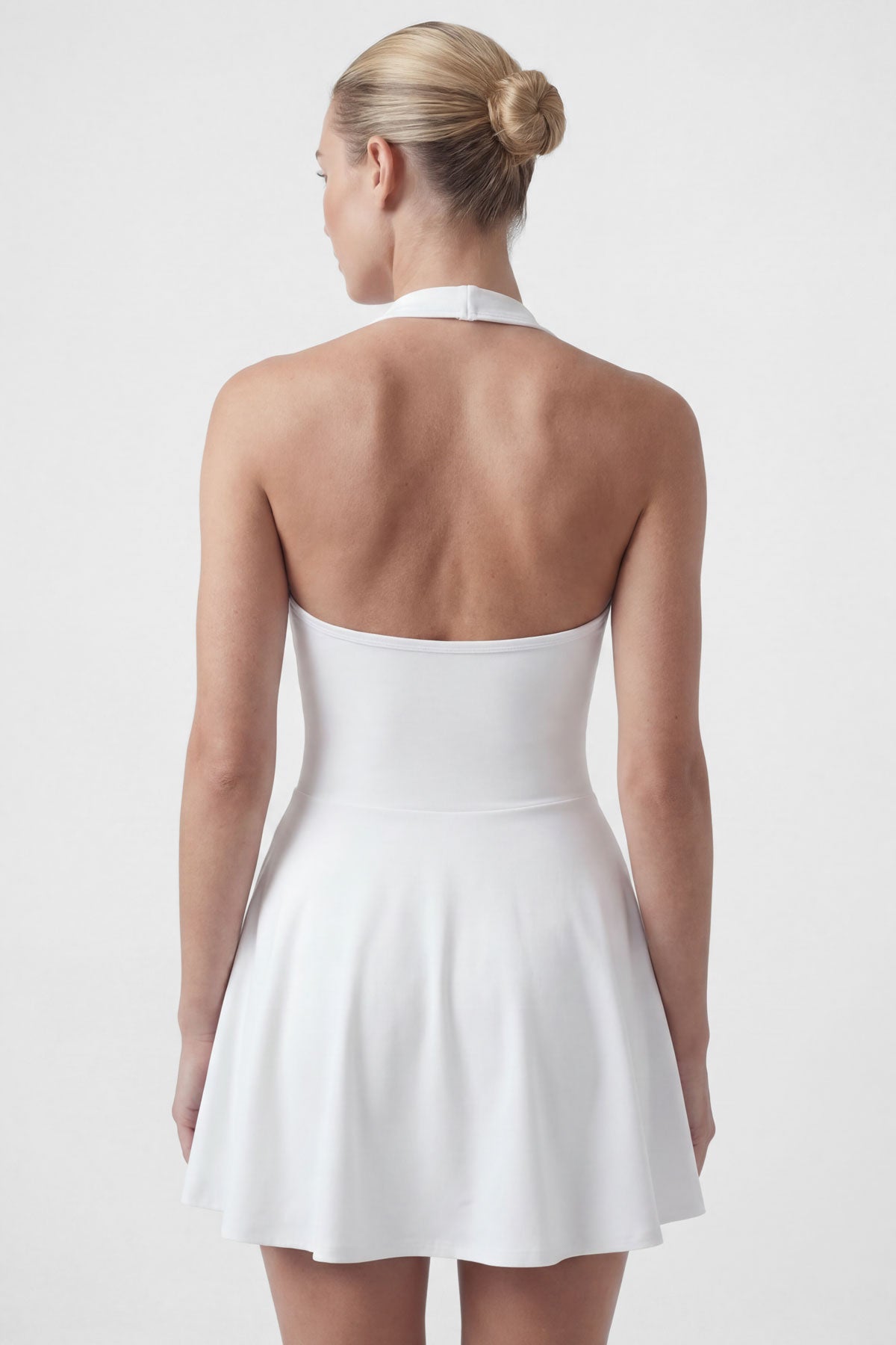 White golf dress with built-in shorts and halter neck