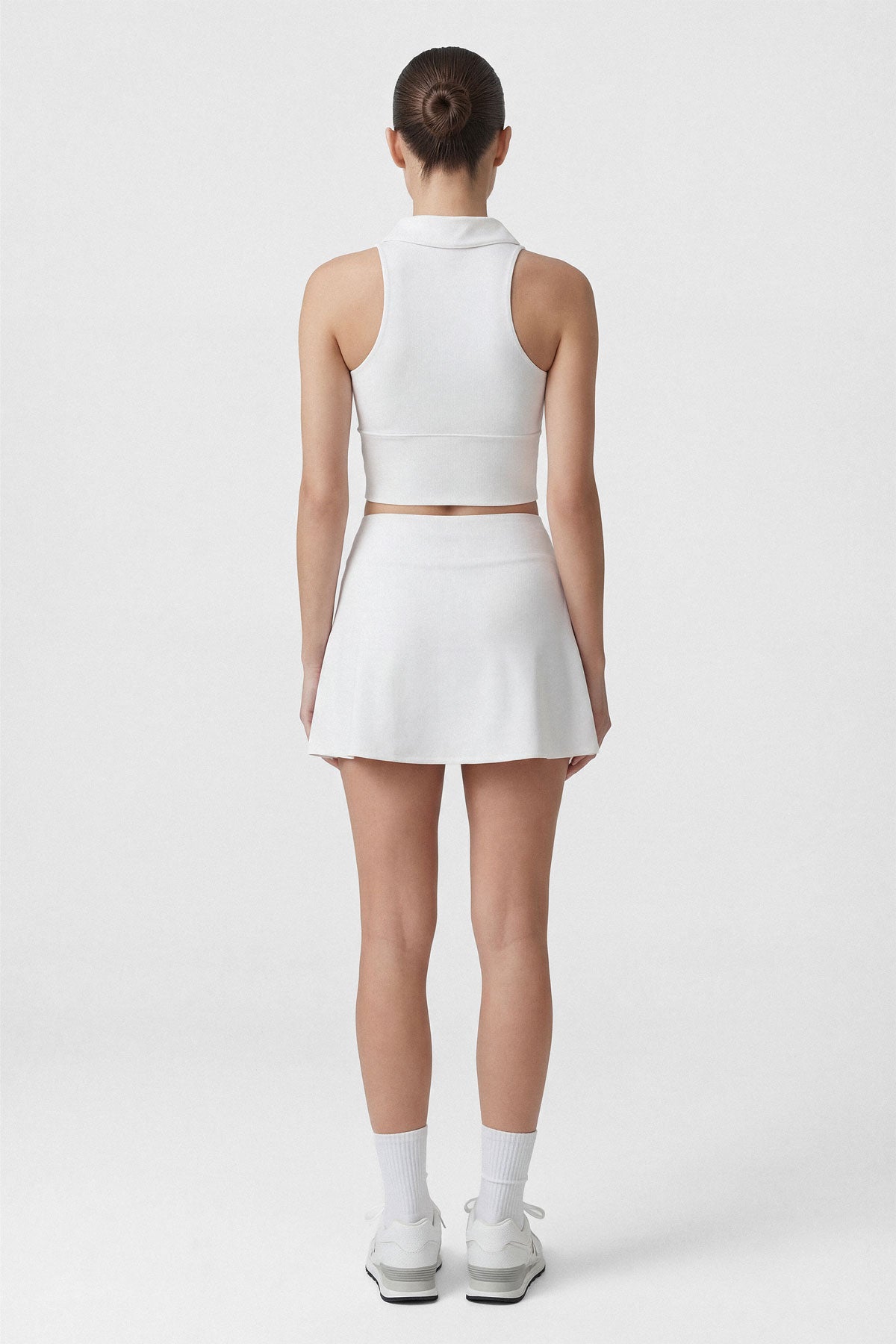 White golf skort with built in shorts, side slit and pocket
