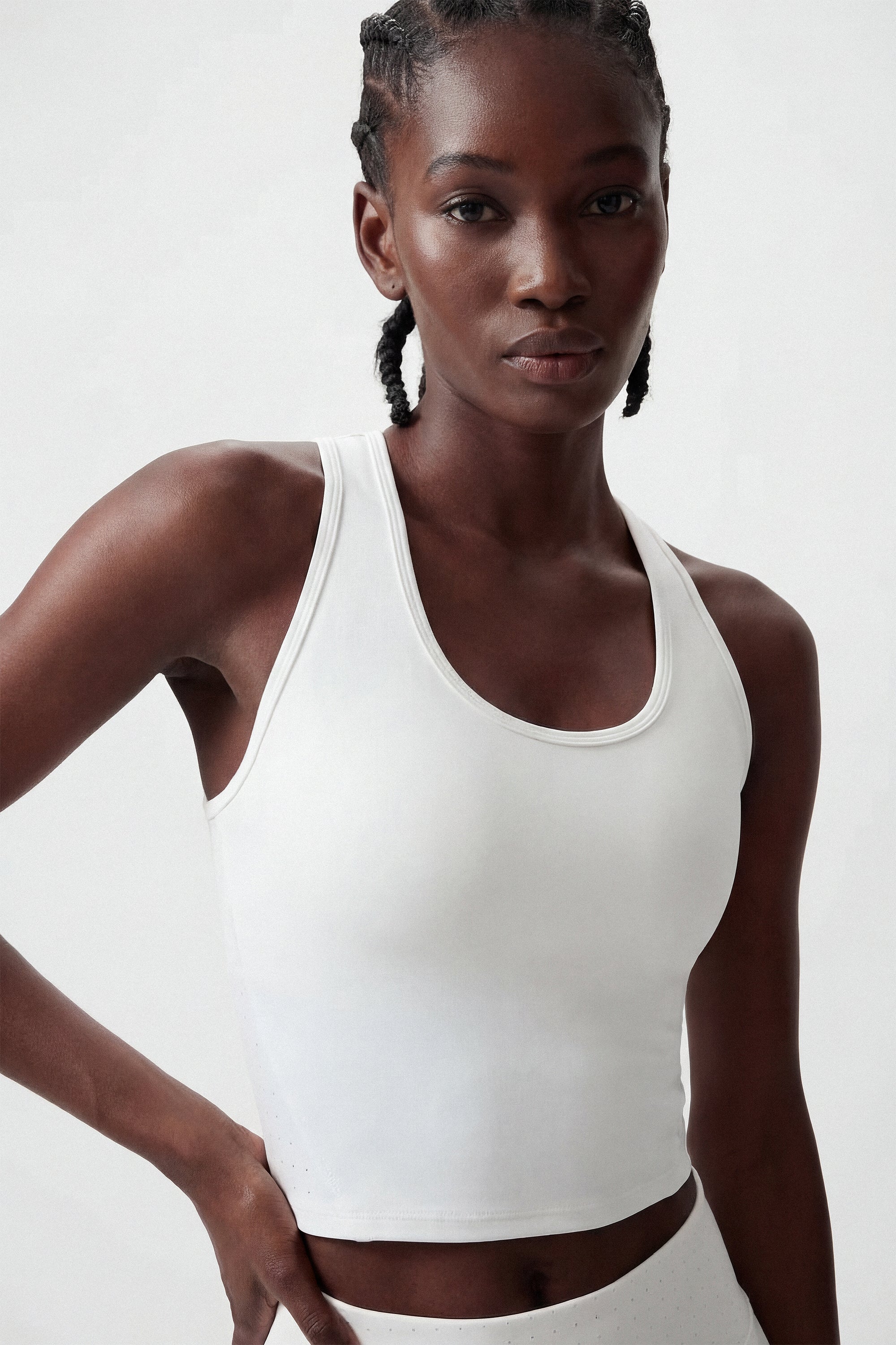 Woman wearing a white tennis crop top