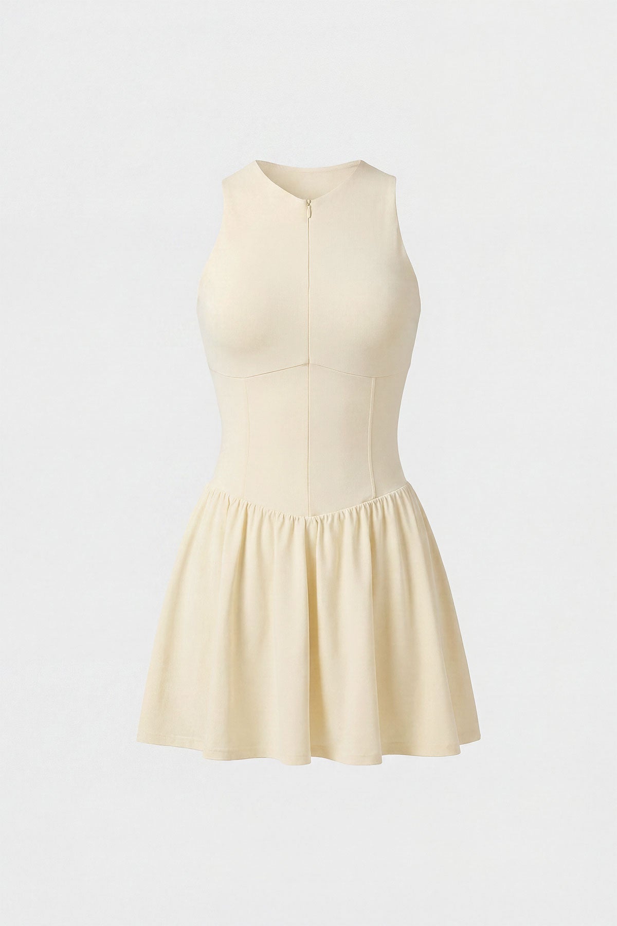 A butter yellow sleeveless tennis dress with a zipper closure, built-in shorts and a pocket
