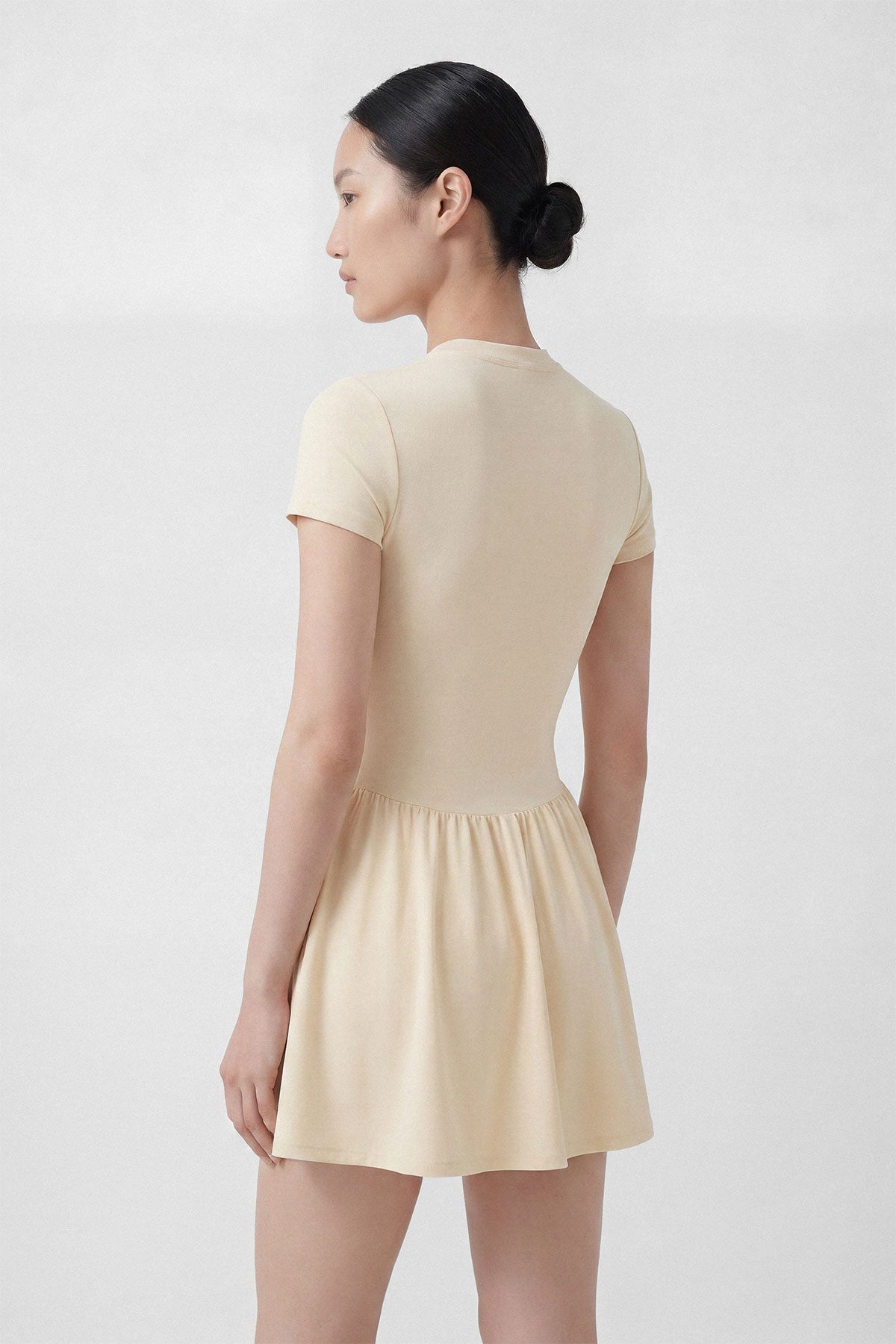 Butter yellow golf dress with short sleeves, built-in shorts and pocket