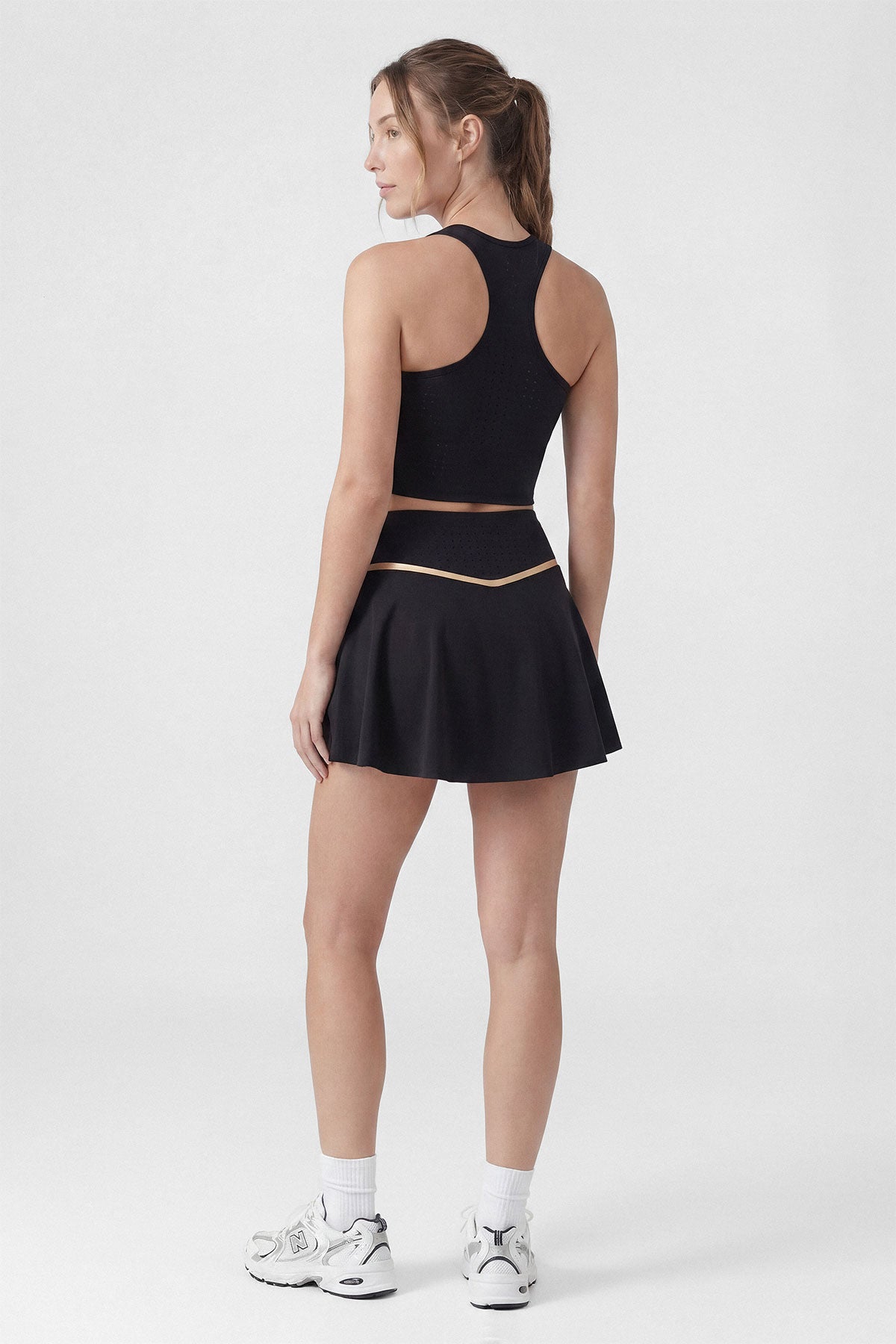 A black tennis skirt with built-in shorts and pocket