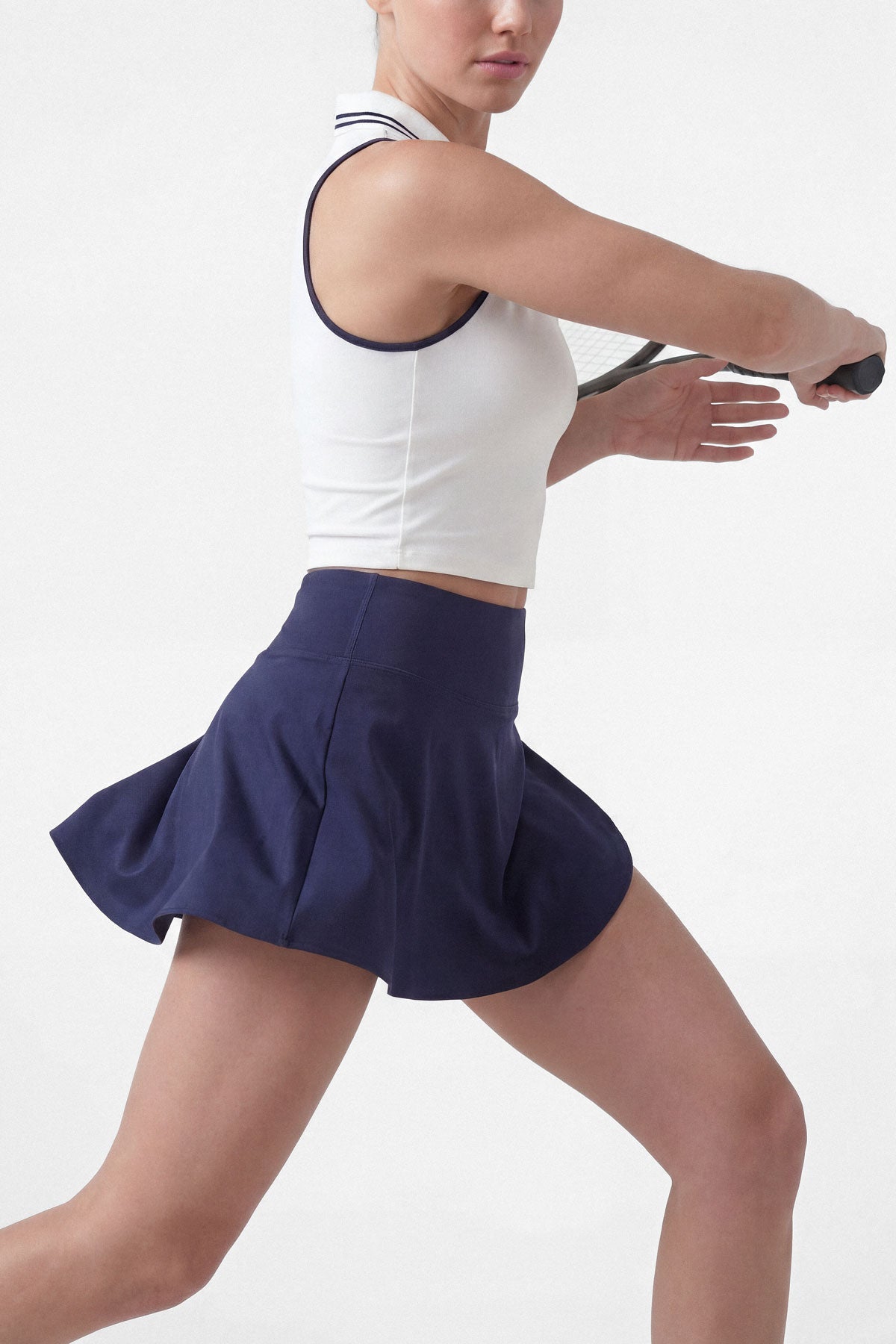 Flared tennis skirt in navy blue with built-in shorts and pocket