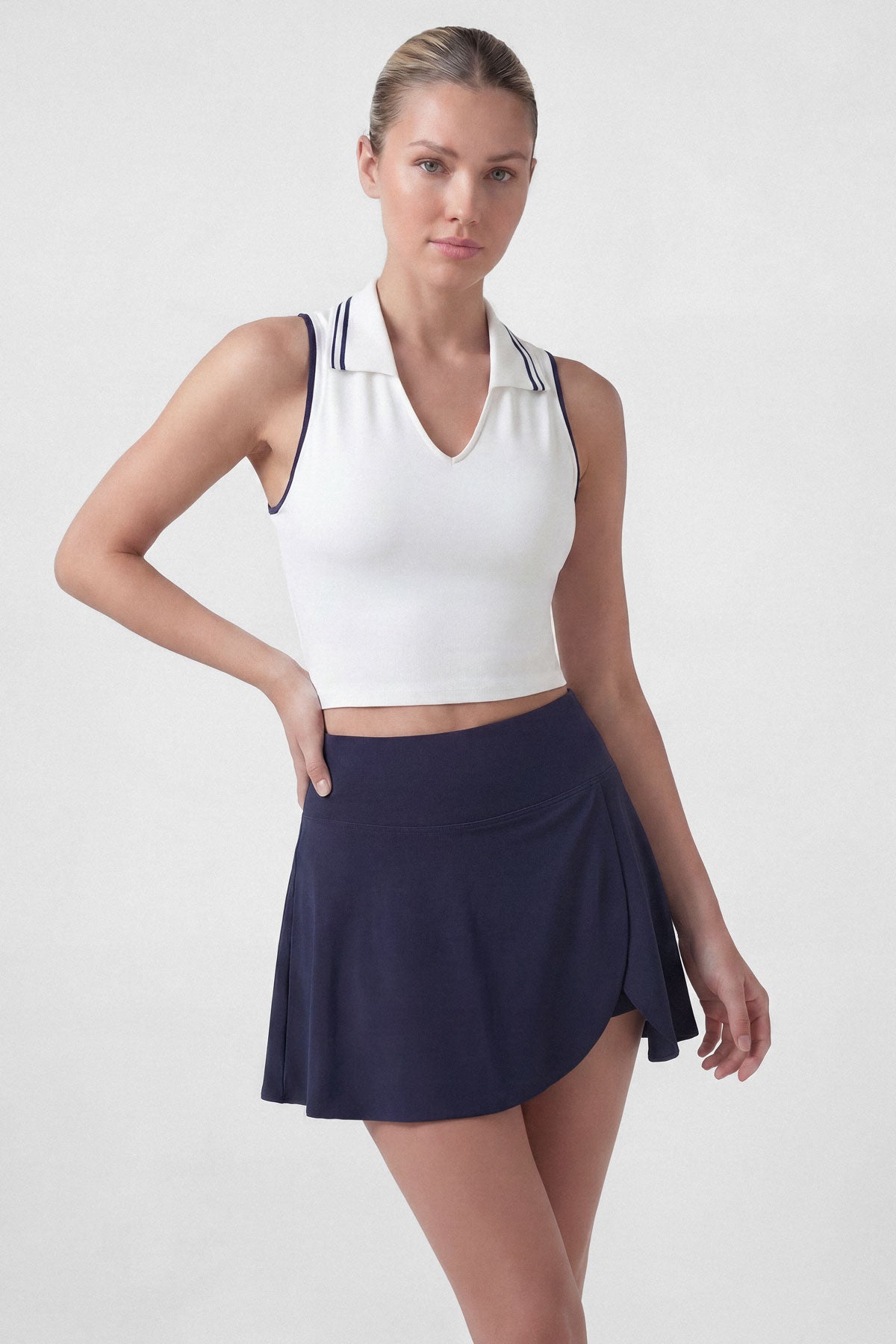 Flared tennis skirt in navy blue with built-in shorts and pocket