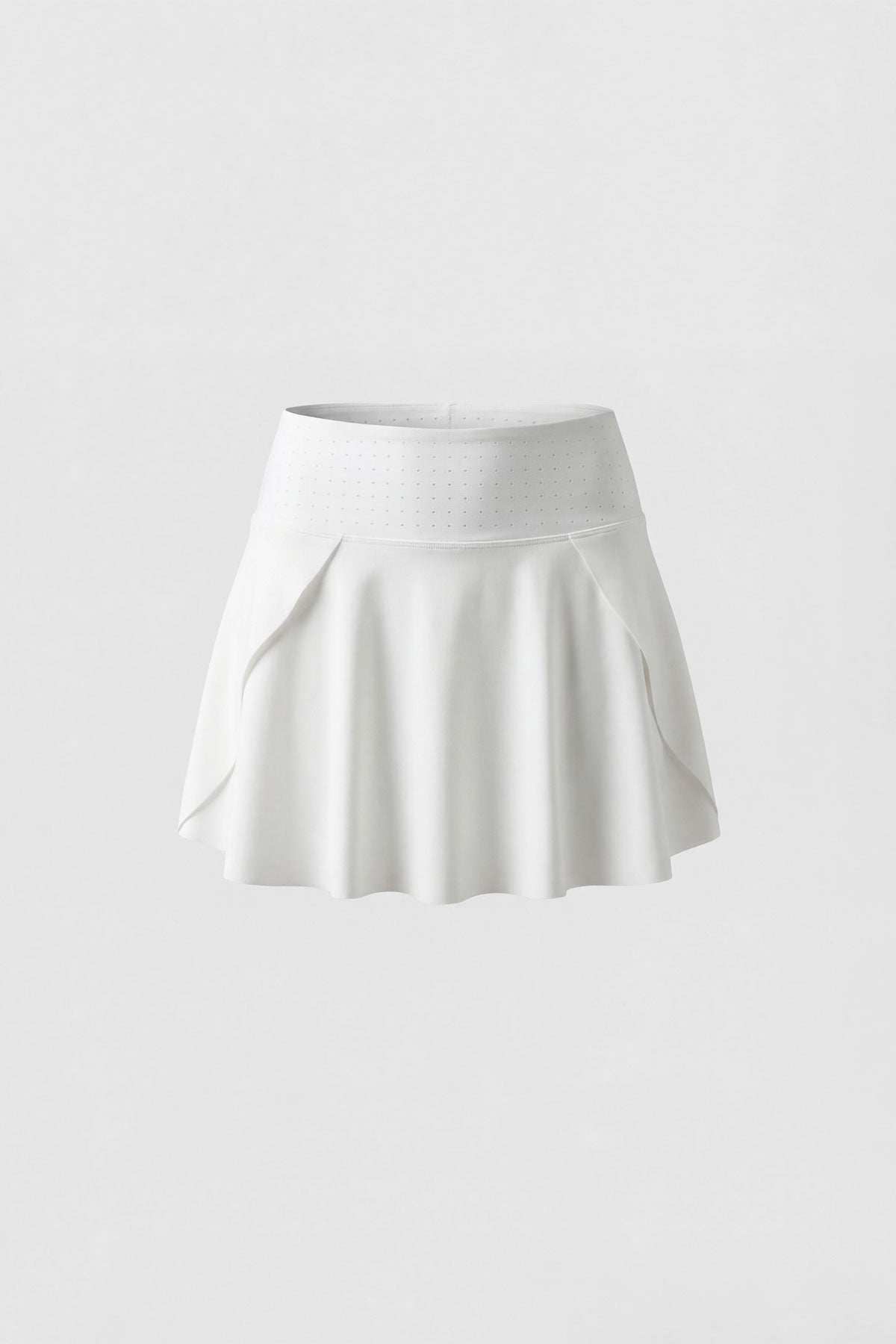 A flattering flared tennis skirt in white with built-in shorts and a side pocket